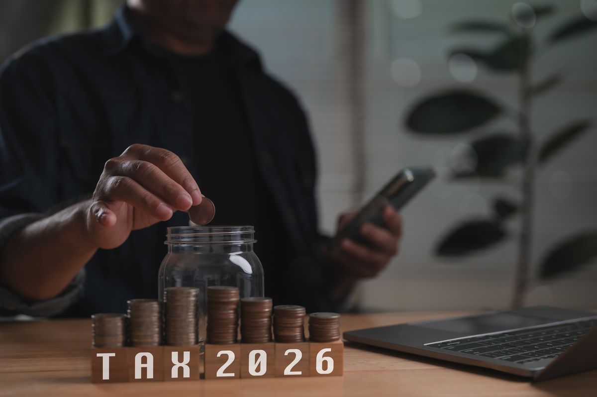 Man,Plans,Future,Tax,2026,Obligations,,Saving,Money,Placing,Coin